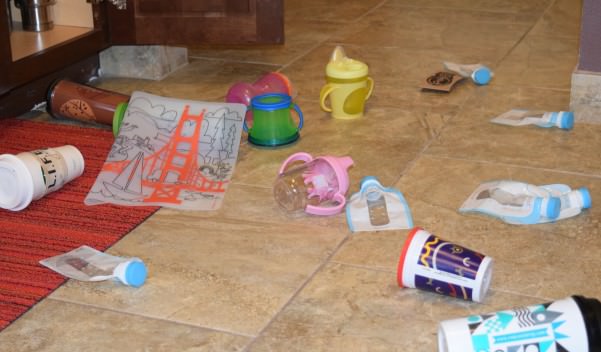 The scene in our kitchen after our daughter played in her kid cabinet