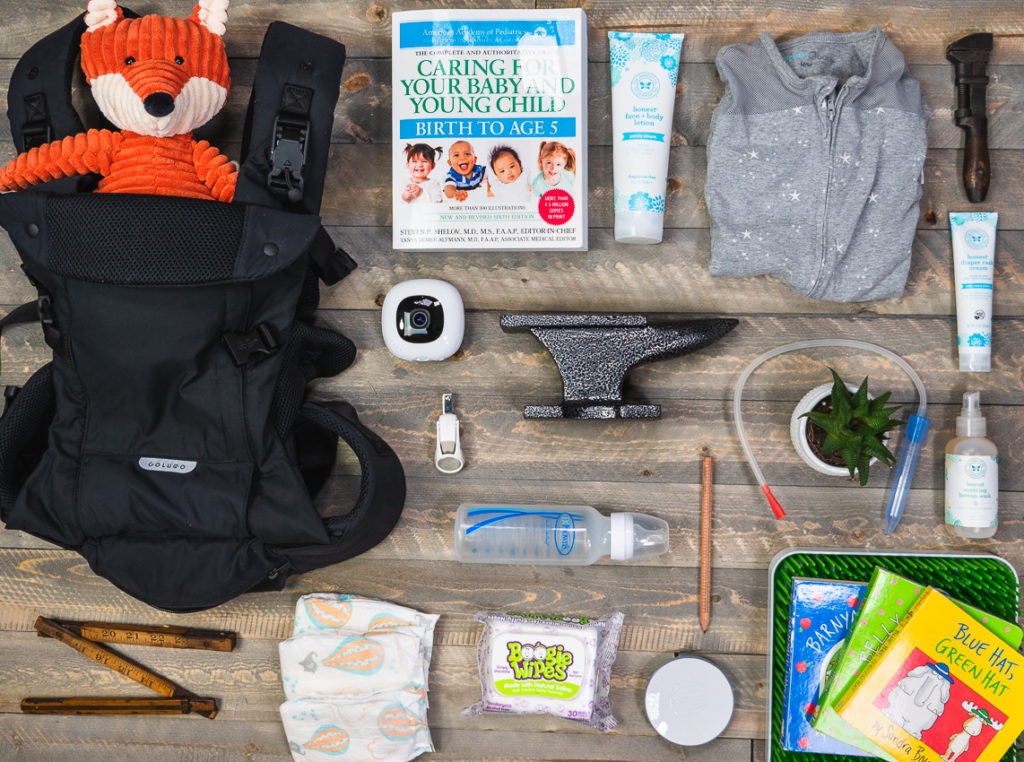 A collection of baby essentials laid out on a table