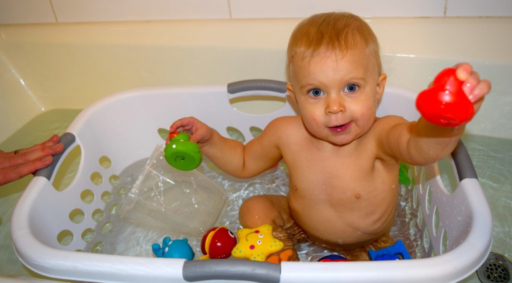 Use a laundry basket to hack your baby's bath. Toys will remain in reach and your baby will stay balanced.