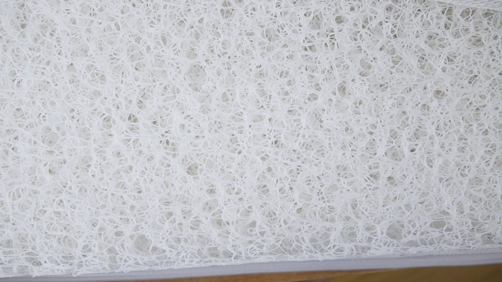 A top down shot of the Newton baby crib mattress without the cover